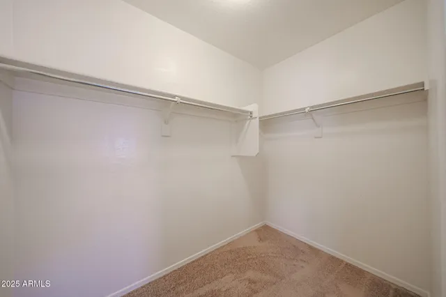 a view of an empty walk in closet
