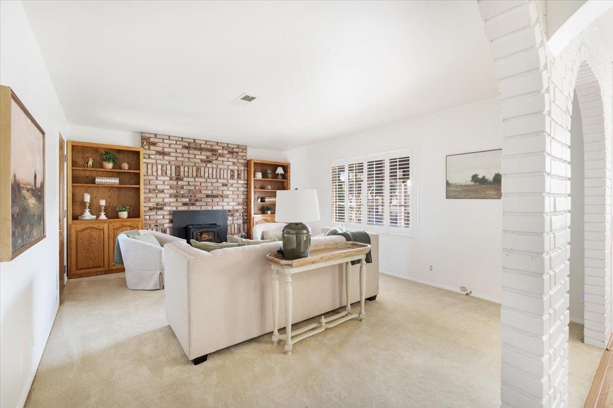 172 West Phillips Road Watsonville, CA 95076 - Photo 13 of 42 a living room with furniture and a fireplace