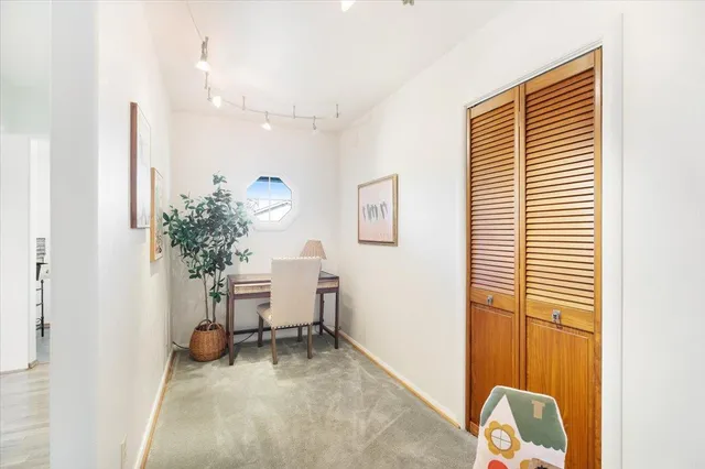 a workspace with furniture and a window