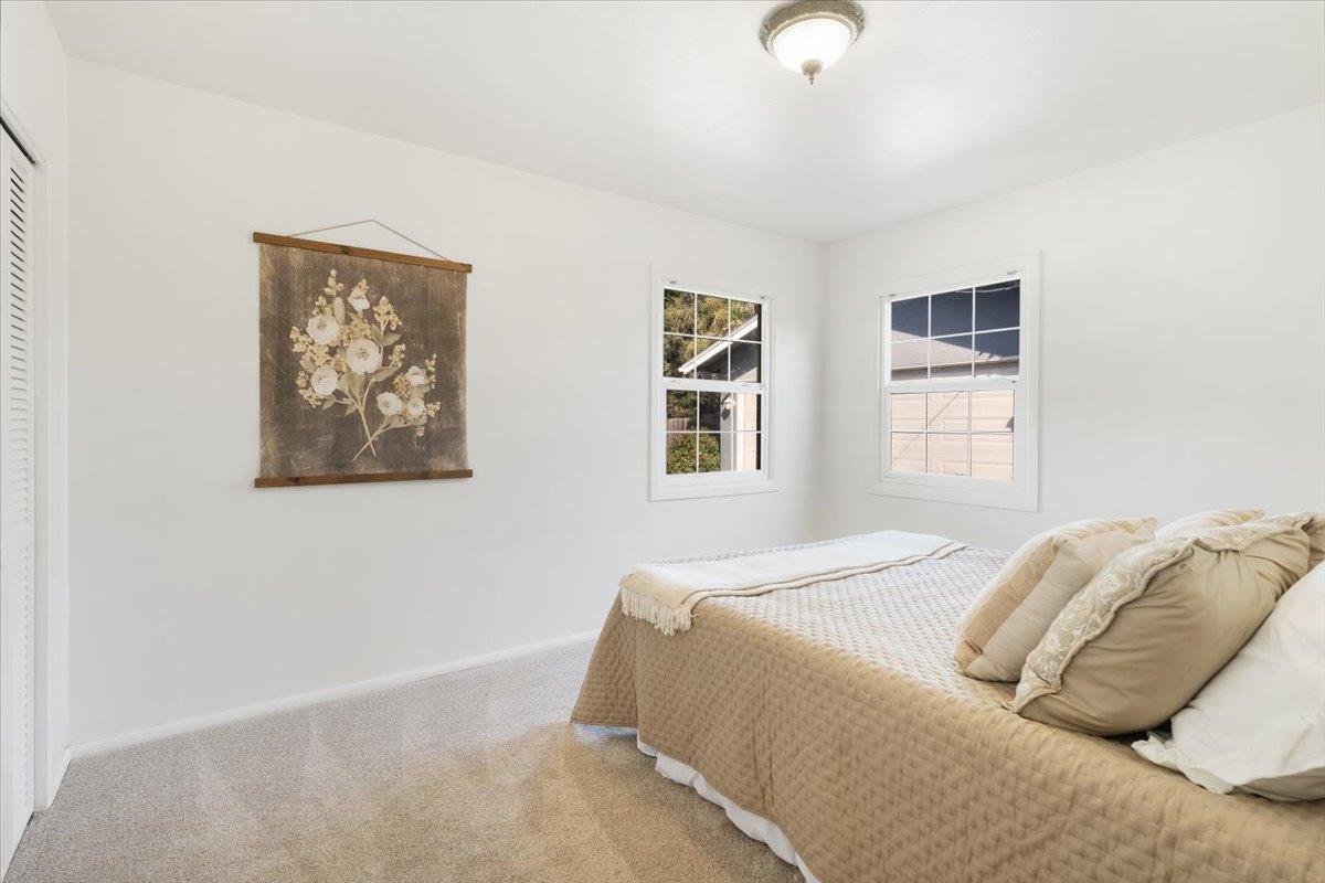 172 West Phillips Road Watsonville, CA 95076 - Photo 21 of 42 a bedroom with bed and a window