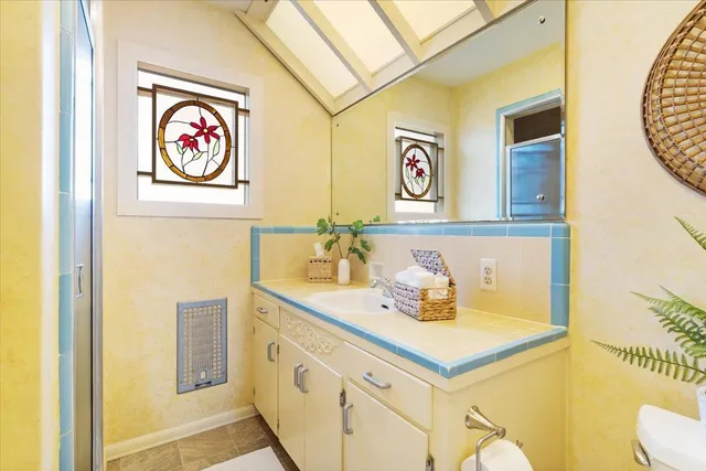 a bathroom with a sink and a mirror