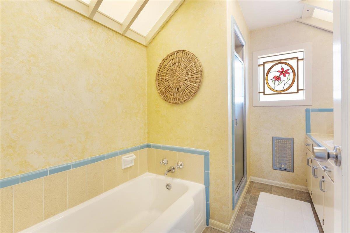 172 West Phillips Road Watsonville, CA 95076 - Photo 23 of 42 a bathroom with a bathtub and a shower