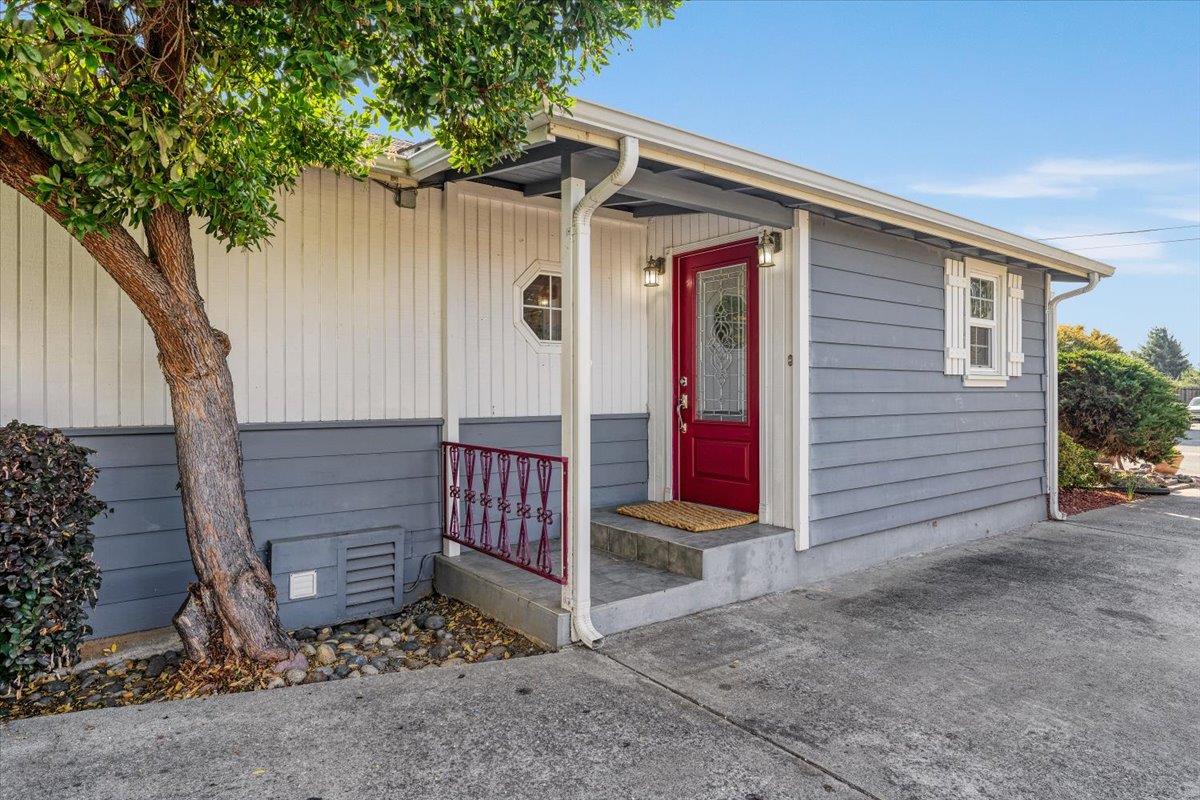 172 West Phillips Road Watsonville, CA 95076 - Photo 27 of 42 a view of a house with wooden fence and a tree
