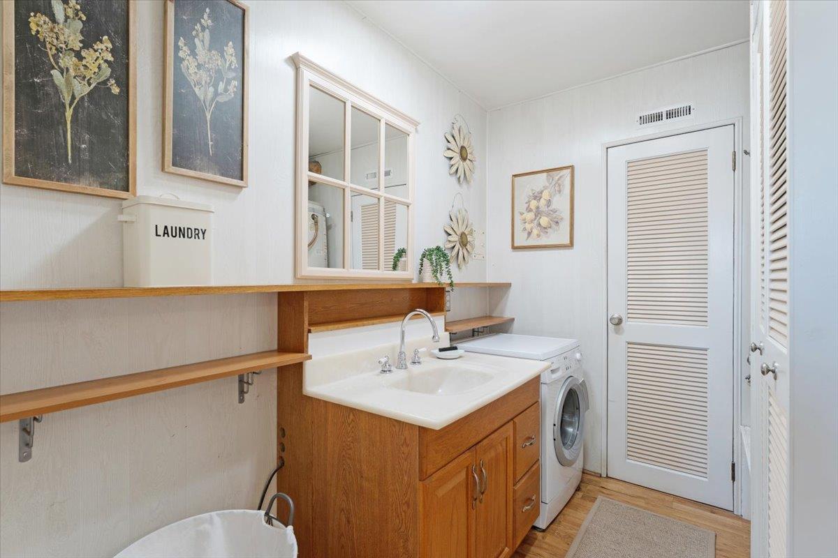 172 West Phillips Road Watsonville, CA 95076 - Photo 37 of 42 a bathroom with a sink mirror vanity and toilet