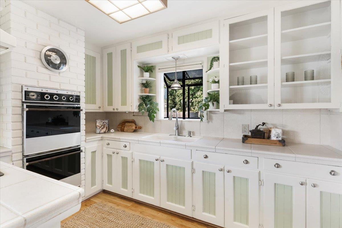 172 West Phillips Road Watsonville, CA 95076 - Photo 6 of 42 a kitchen with stainless steel appliances a stove microwave and cabinets