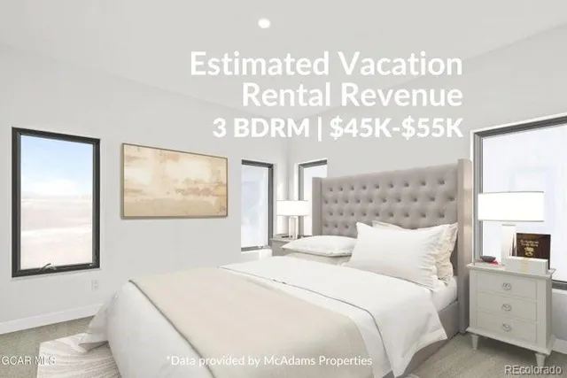 a bedroom with a bed and a large mirror