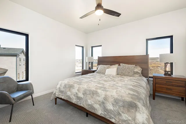 a bedroom with a bed and a lamp