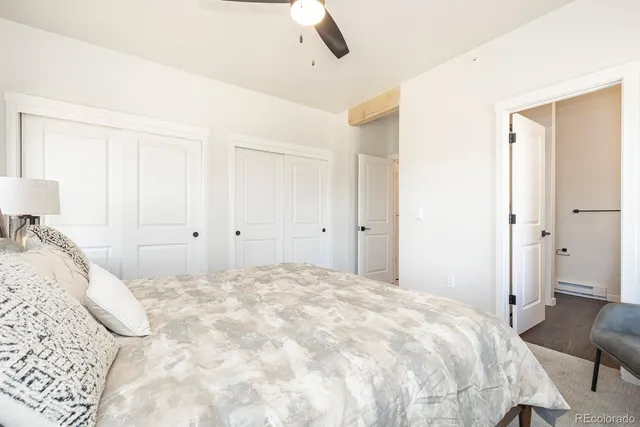 a bedroom with a large bed and a large window