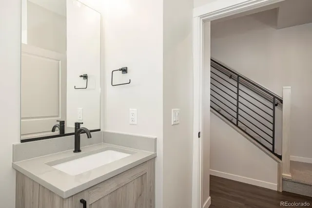 a kitchen with stainless steel appliances granite countertop a sink and stove top oven