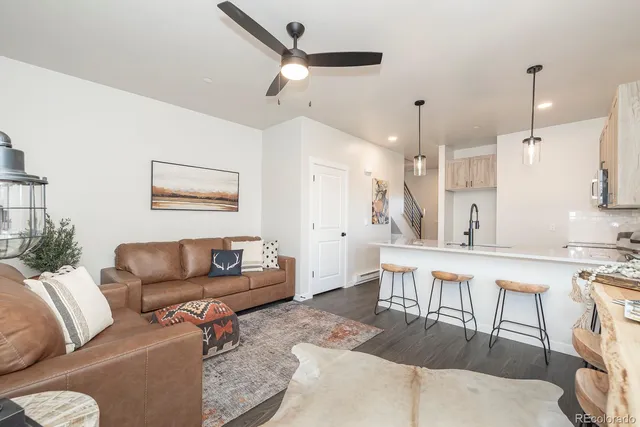 a large kitchen with a table and chairs