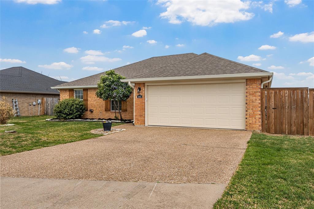 4401 Lacey Circle Waco, TX 76708 - Photo 2 of 38 a front view of a house with a yard and garage