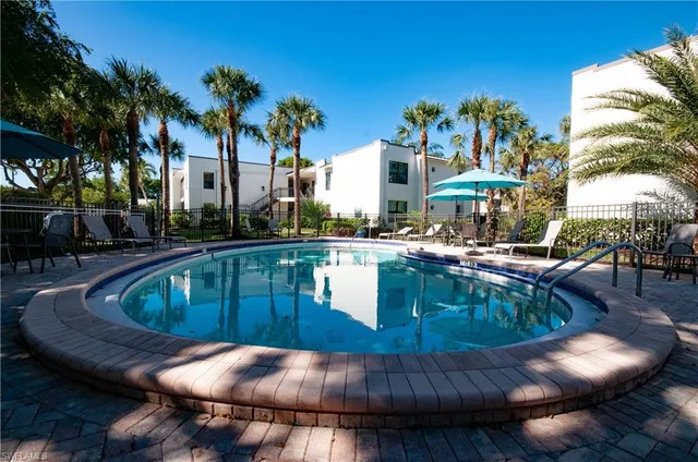 a view of a swimming pool with a patio