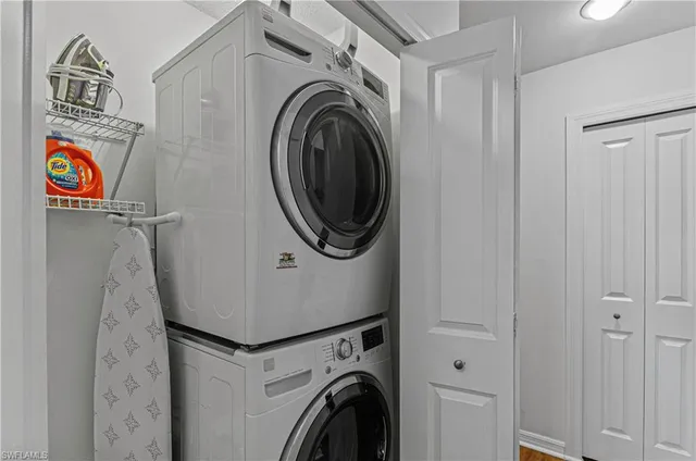 a bedroom with a large bed and window