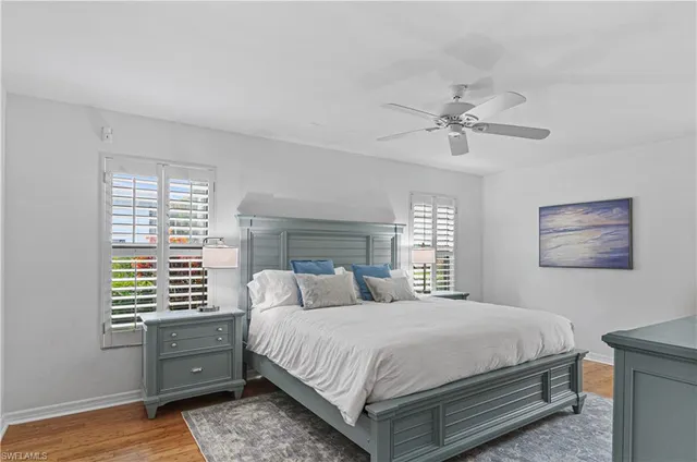 a bedroom with a bed and a dresser in it