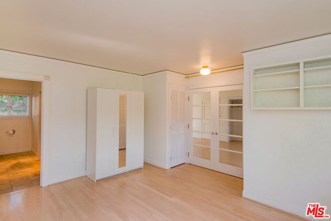 5233 Village Green Los Angeles, CA 90016 - Photo 19 of 34 a view of an empty room with a window