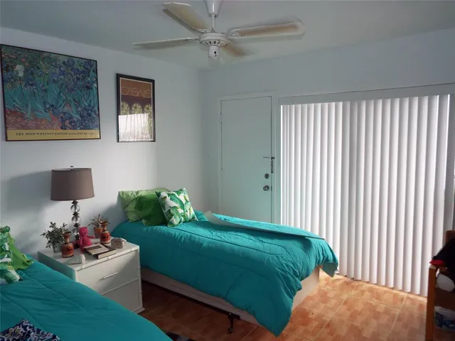 a living room with furniture and a wooden door