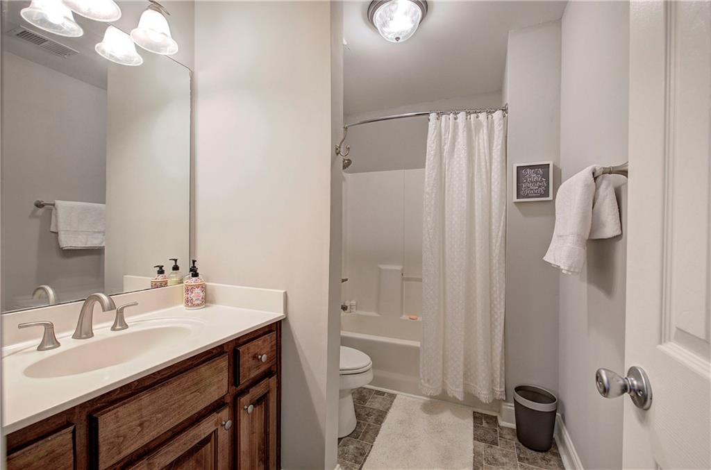 618 Manor Way Cartersville, GA 30120 - Photo 24 of 35 a bathroom with a sink a toilet and shower