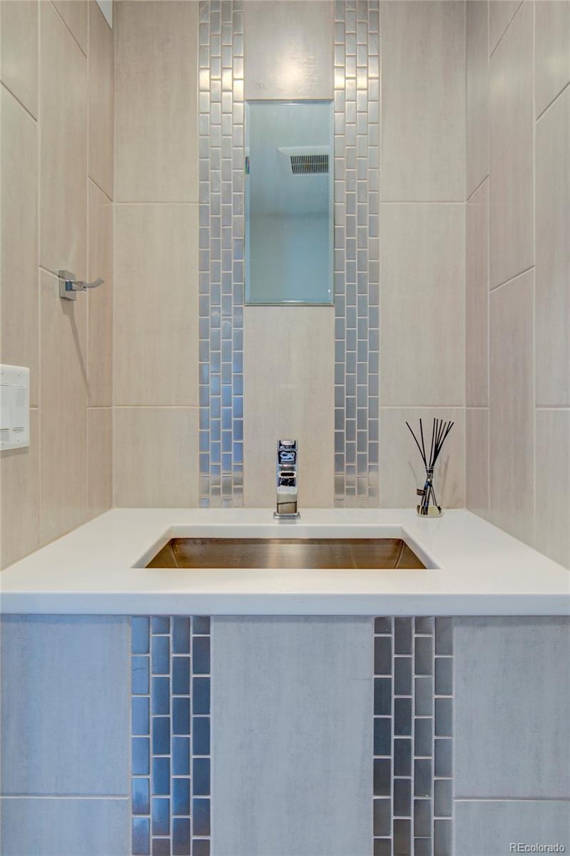 1322 South Pearl Street Denver, CO 80210 - Photo 15 of 39 a bathroom with a sink and a shower