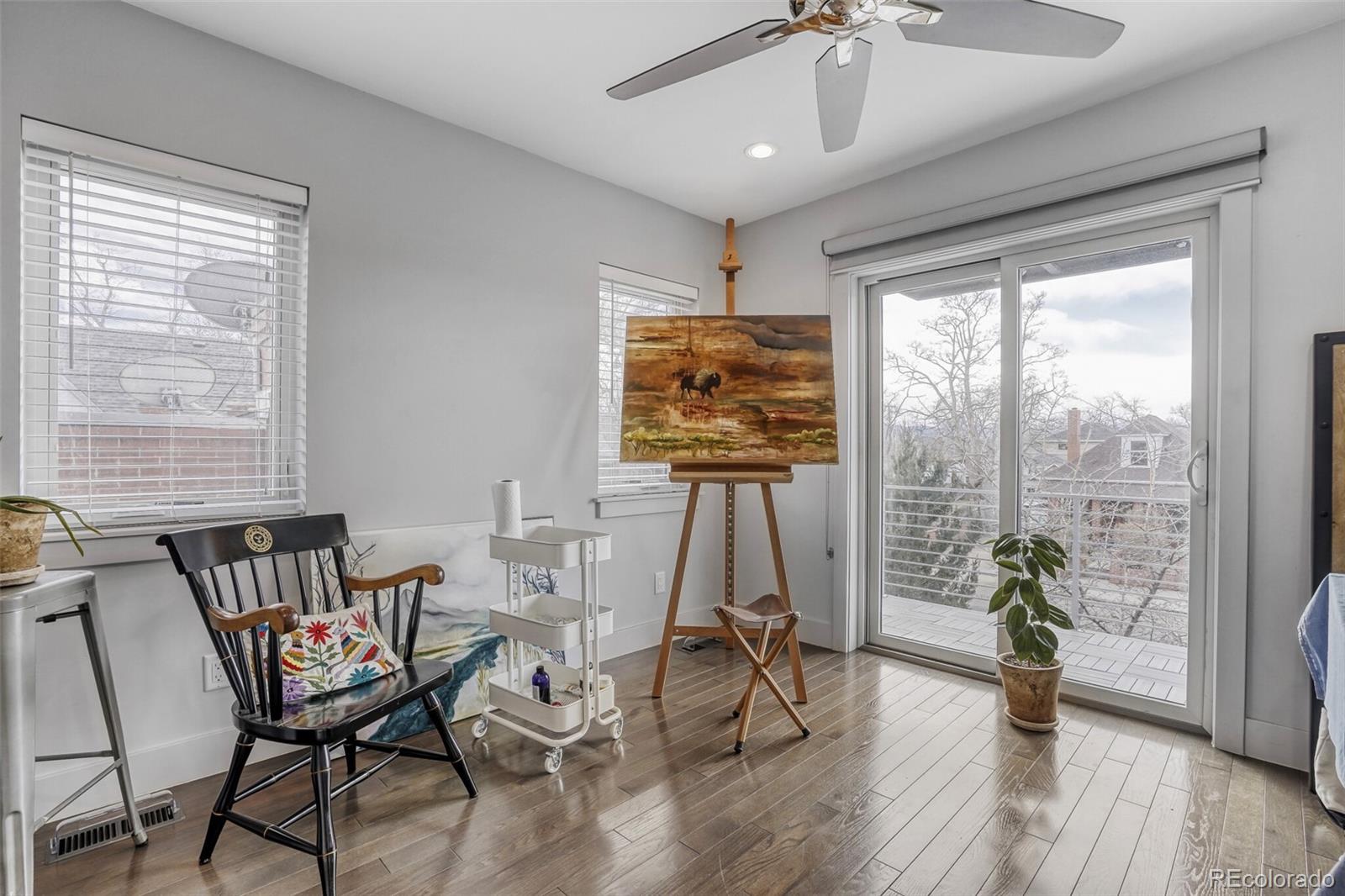 1322 South Pearl Street Denver, CO 80210 - Photo 22 of 39 a view of a livingroom with furniture window and wooden floor