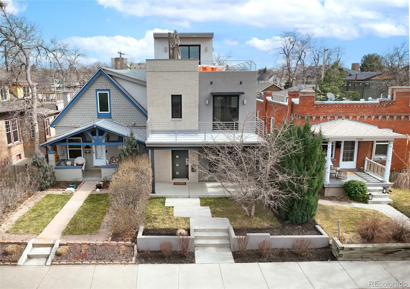 1322 South Pearl Street Denver, CO 80210 - Photo 6 of 39 a front view of a house with a yard