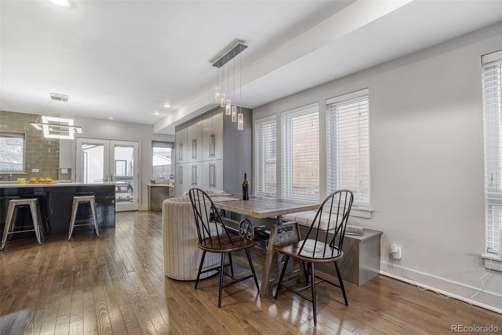 1322 South Pearl Street Denver, CO 80210 - Photo 10 of 39 a view of a dining room with furniture and wooden floor