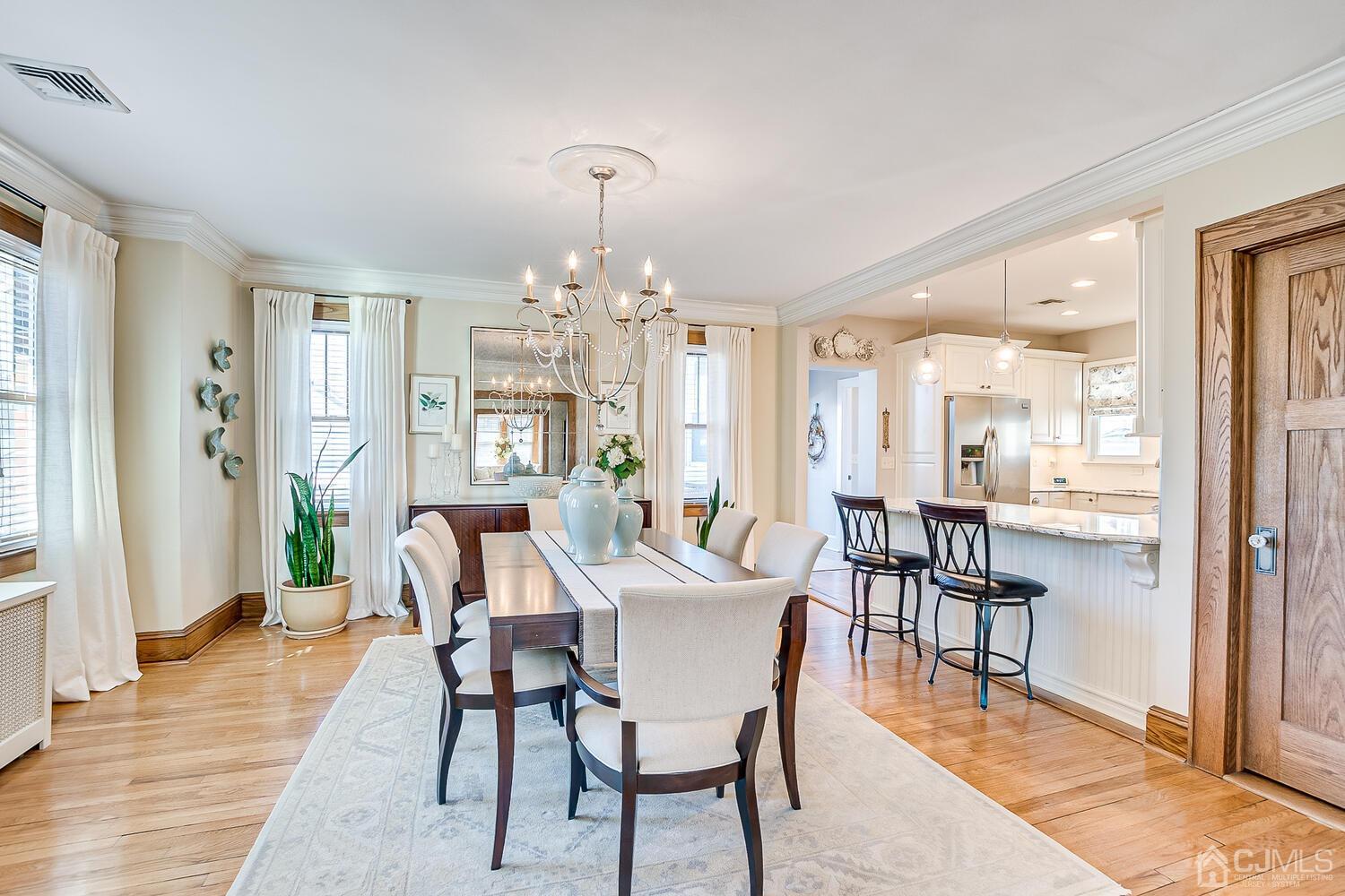 29 Jefferson Avenue Edison, NJ 08837 - Photo 11 of 36 a view of a a dining room with furniture window and wooden floor