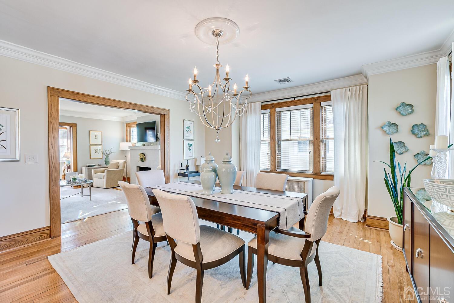 29 Jefferson Avenue Edison, NJ 08837 - Photo 12 of 36 a view of a dining room with furniture and wooden floor