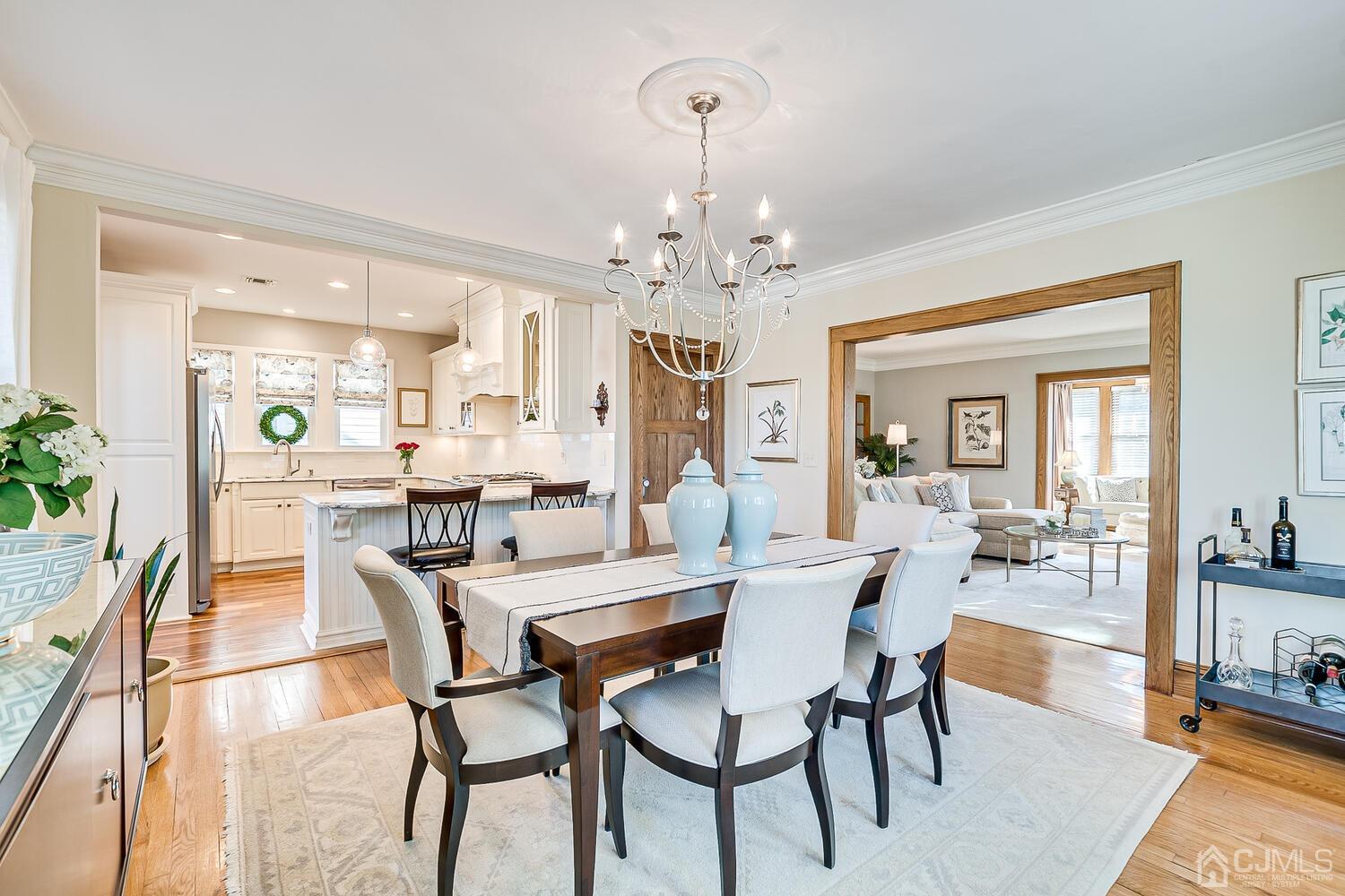 29 Jefferson Avenue Edison, NJ 08837 - Photo 13 of 36 a view of a dining room with furniture and a chandelier