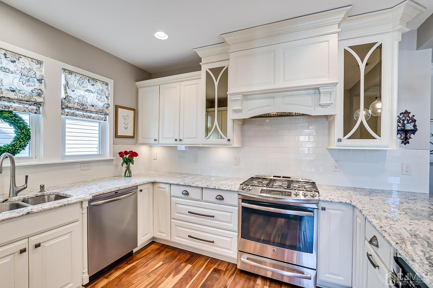 29 Jefferson Avenue Edison, NJ 08837 - Photo 17 of 36 a kitchen with cabinets appliances a sink and a window