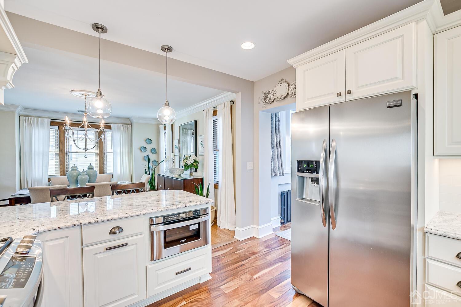29 Jefferson Avenue Edison, NJ 08837 - Photo 18 of 36 a kitchen with stainless steel appliances a stove a refrigerator and a sink
