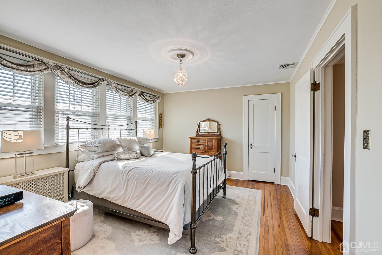 29 Jefferson Avenue Edison, NJ 08837 - Photo 25 of 36 a bedroom with a bed and a large window