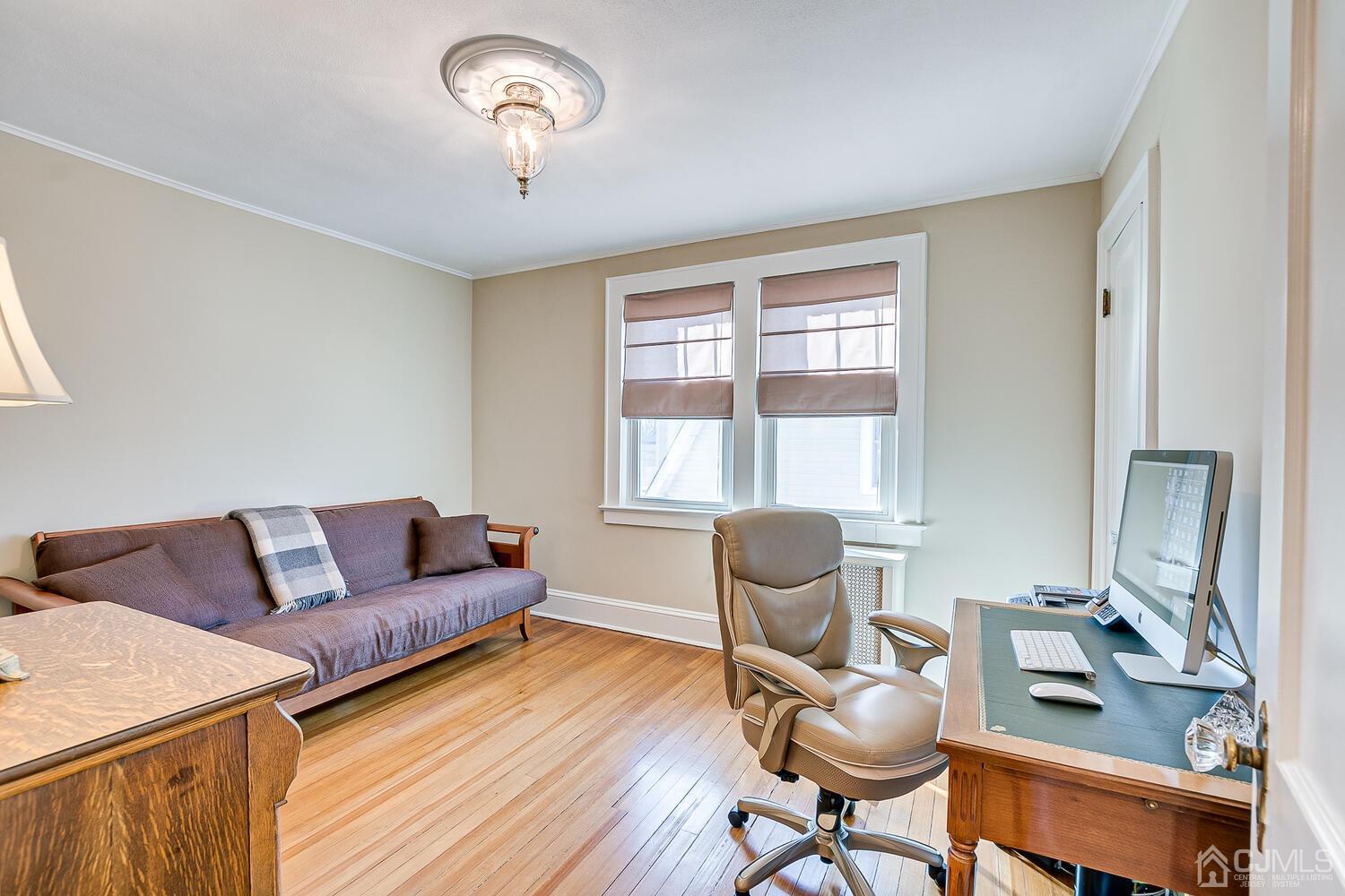29 Jefferson Avenue Edison, NJ 08837 - Photo 28 of 36 a living room with furniture and a window
