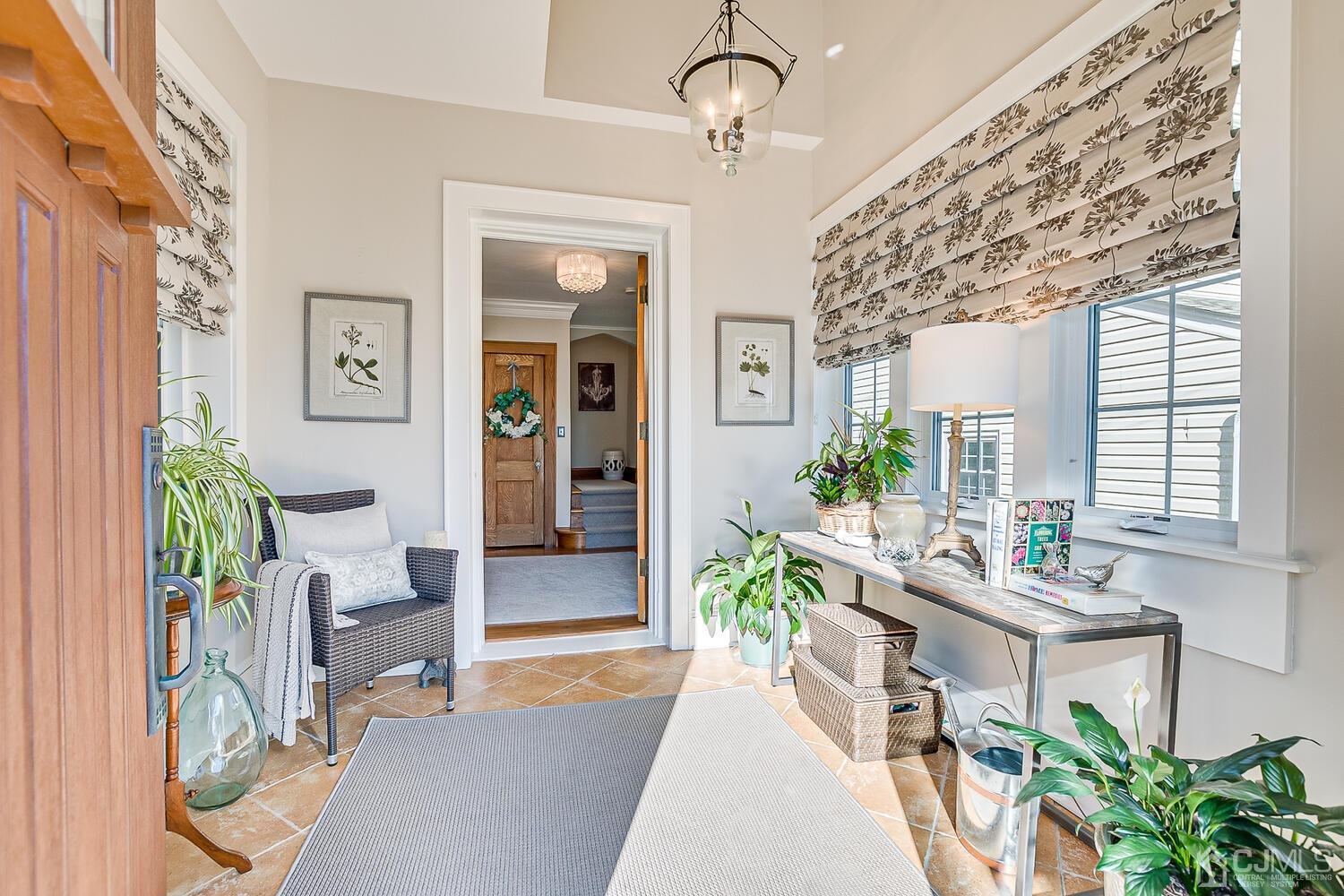 29 Jefferson Avenue Edison, NJ 08837 - Photo 3 of 36 a lobby with furniture and potted plant