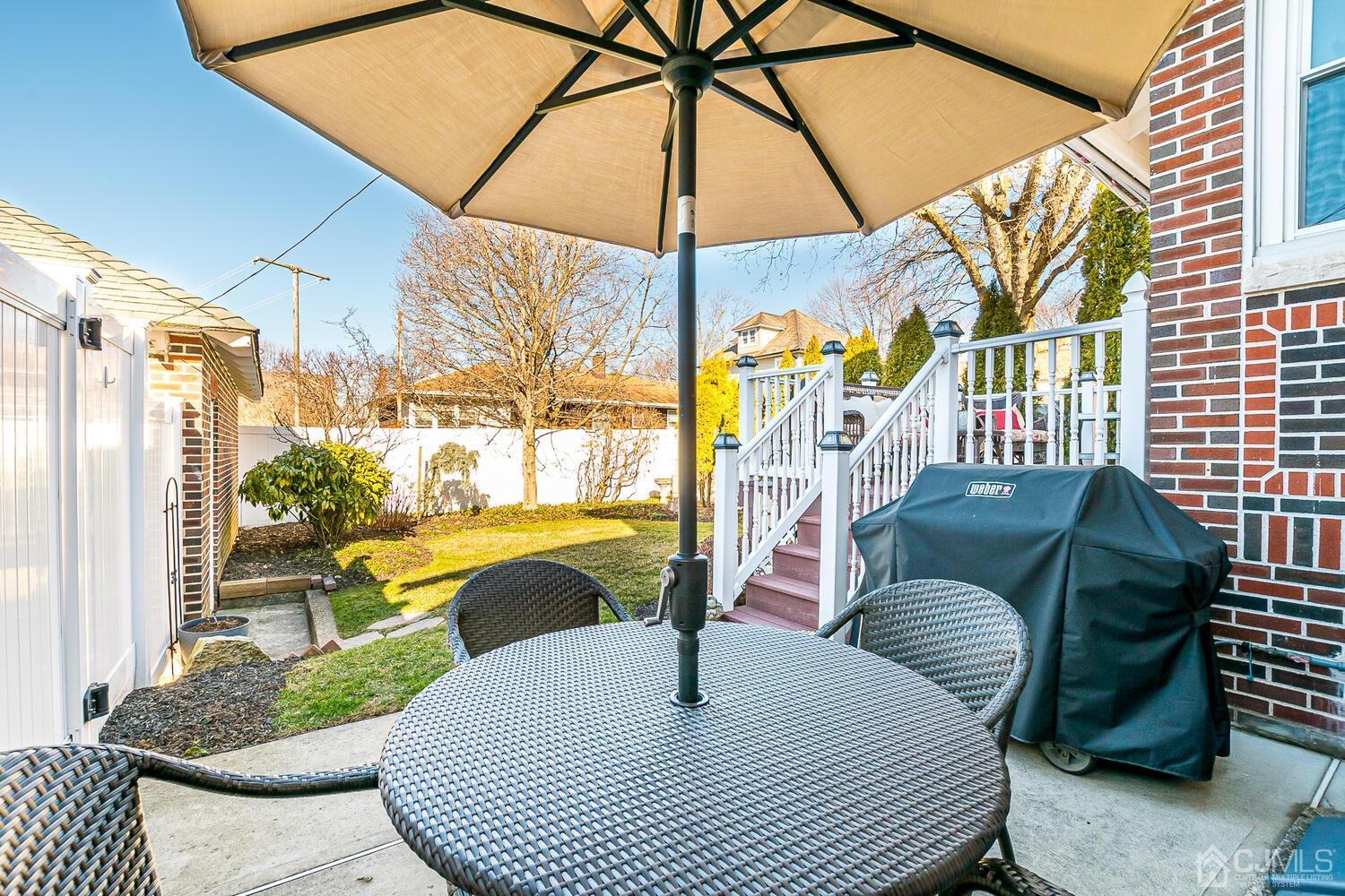 29 Jefferson Avenue Edison, NJ 08837 - Photo 31 of 36 a balcony with furniture and a potted plant