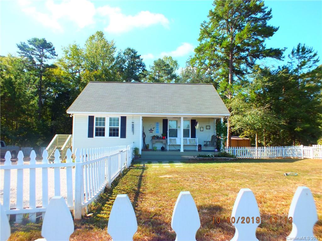 1914 Canal Road Catawba, SC 29704 - Photo 1 of 23 a front view of house with swimming pool and trees in the background