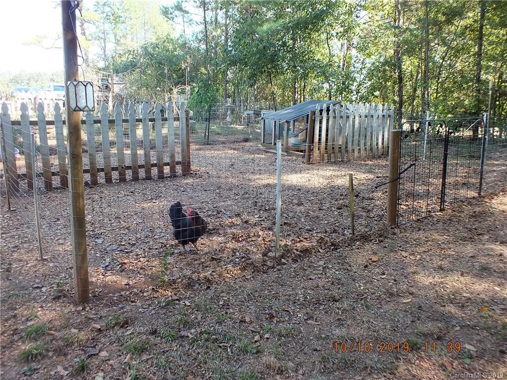 1914 Canal Road Catawba, SC 29704 - Photo 17 of 23 a view of a house with a backyard and fence