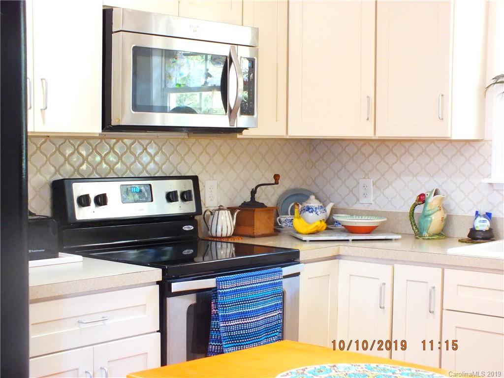 1914 Canal Road Catawba, SC 29704 - Photo 4 of 23 a kitchen with stainless steel appliances granite countertop a stove a sink and a white wooden cabinets