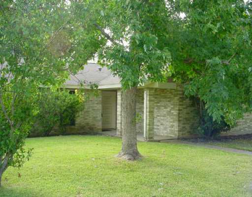 10407 Macmora Road Austin, TX 78758 - Photo 1 of 1 front view of a house with a tree