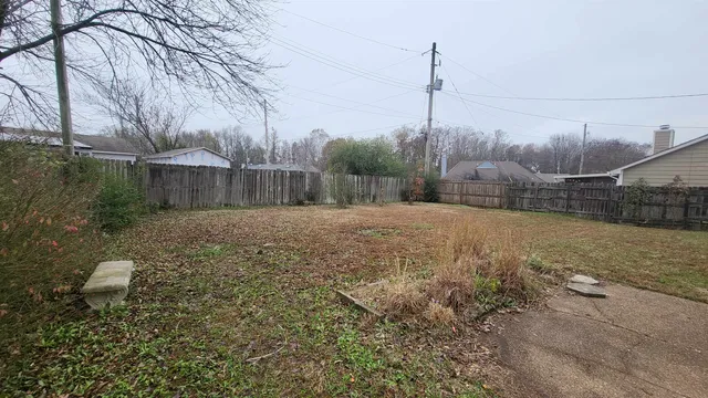 a backyard of a house with lots of green space