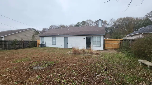a house view with a backyard space