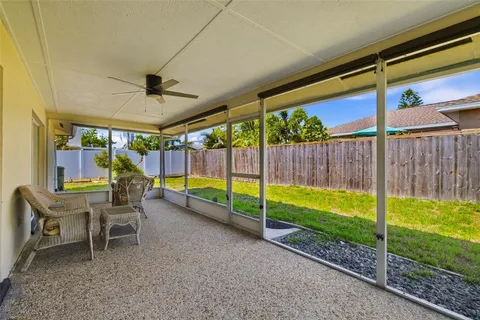 a view of a two chairs in a yard