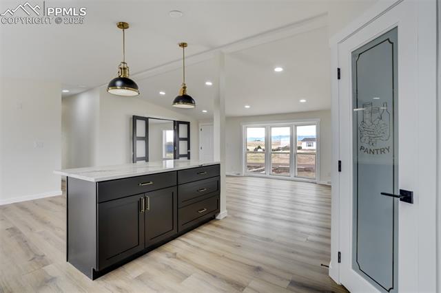 5455 Prospero Road Peyton, CO 80831 - Photo 12 of 47 Kitchen Island has great drawer and cabinet space