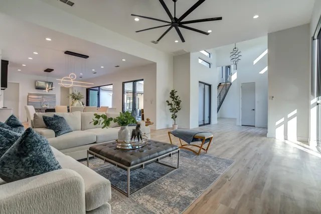 a kitchen with a sink cabinets and wooden floor