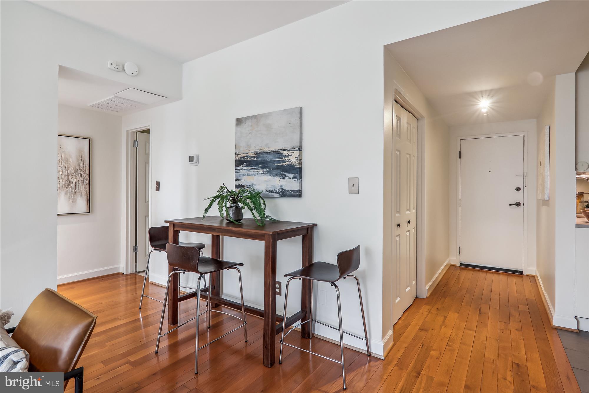1669 Columbia Road Northwest, Unit 204 Washington, DC 20009 - Photo 17 of 42 a view of a dining room with furniture and wooden floor