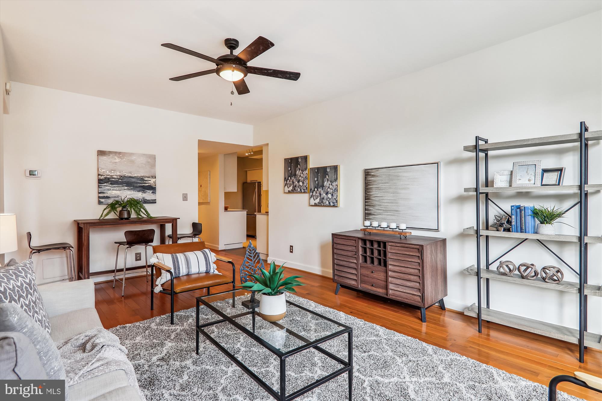 1669 Columbia Road Northwest, Unit 204 Washington, DC 20009 - Photo 18 of 42 a living room with furniture and a chandelier