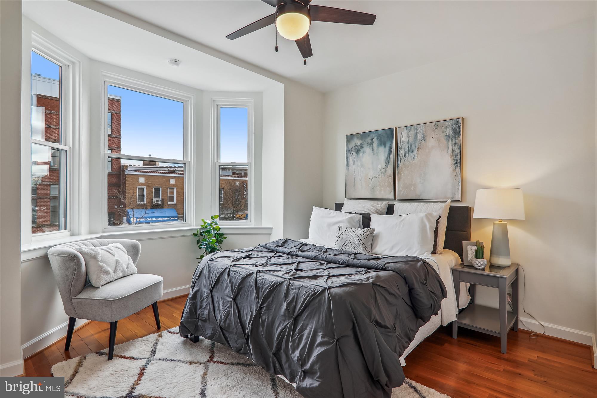 1669 Columbia Road Northwest, Unit 204 Washington, DC 20009 - Photo 23 of 42 a bedroom with a bed and window