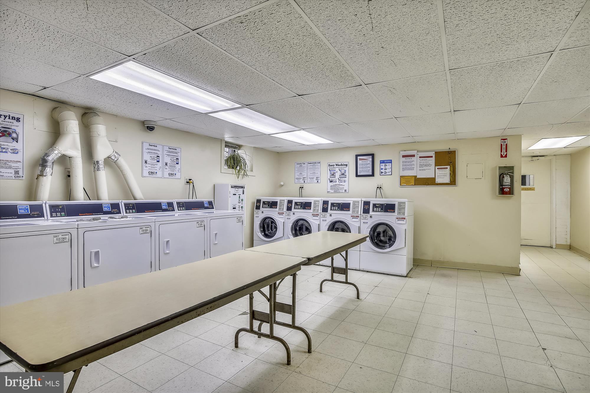 1669 Columbia Road Northwest, Unit 204 Washington, DC 20009 - Photo 27 of 42 a room with gym equipment and mirrors