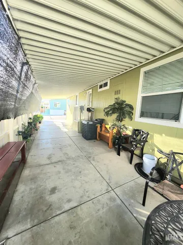 a lobby with furniture and potted plants