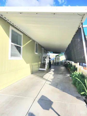 a view of a balcony with chairs