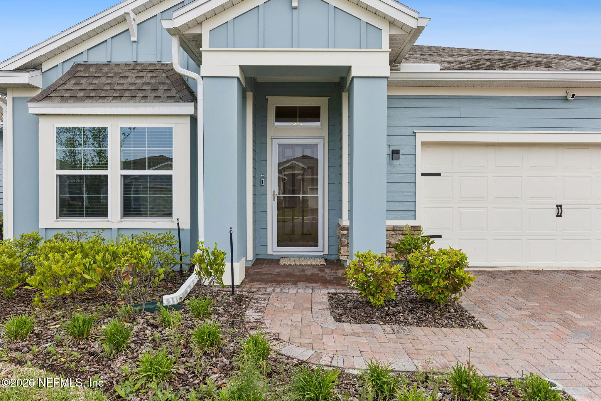 75626 Pondside Lane Yulee, FL 32097 - Photo 1 of 95 a front view of a house with a yard